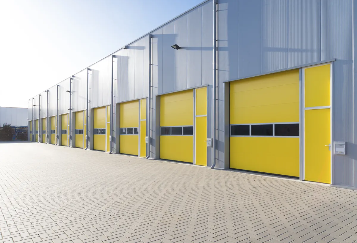 Commercial building with yellow roll-up doors